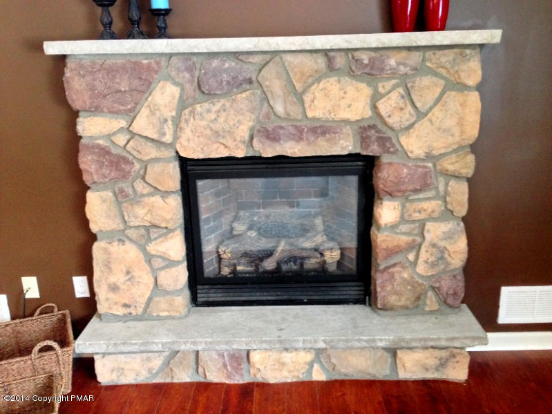 1148 Sunside Road Long Pond, PA 18334 - Photo 13 of 20 a view of a fireplace with wooden floor