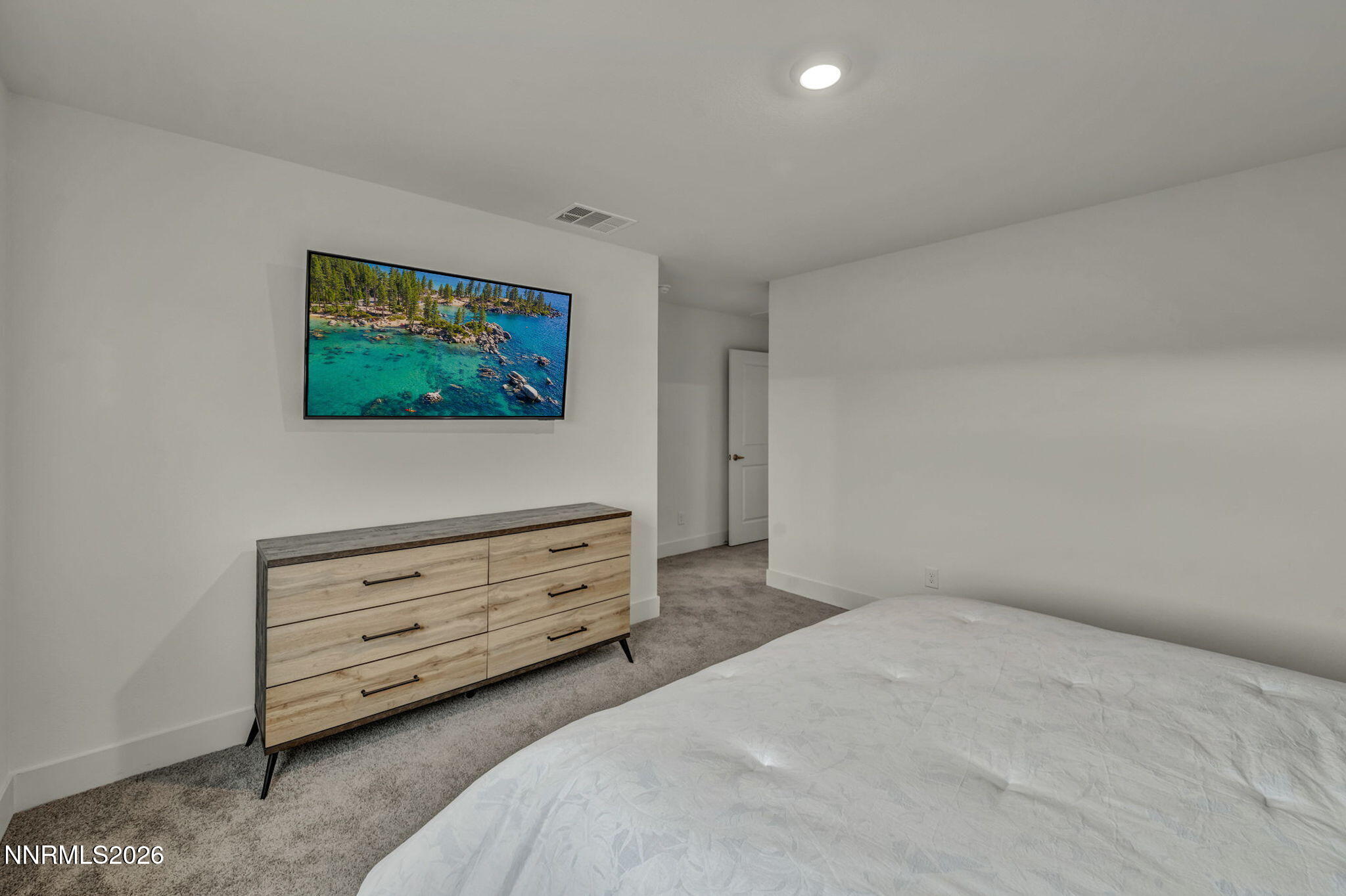 1634 Icelandic Way Reno, NV 89523 - Photo 21 of 49 a bedroom with a bed and a flat screen tv