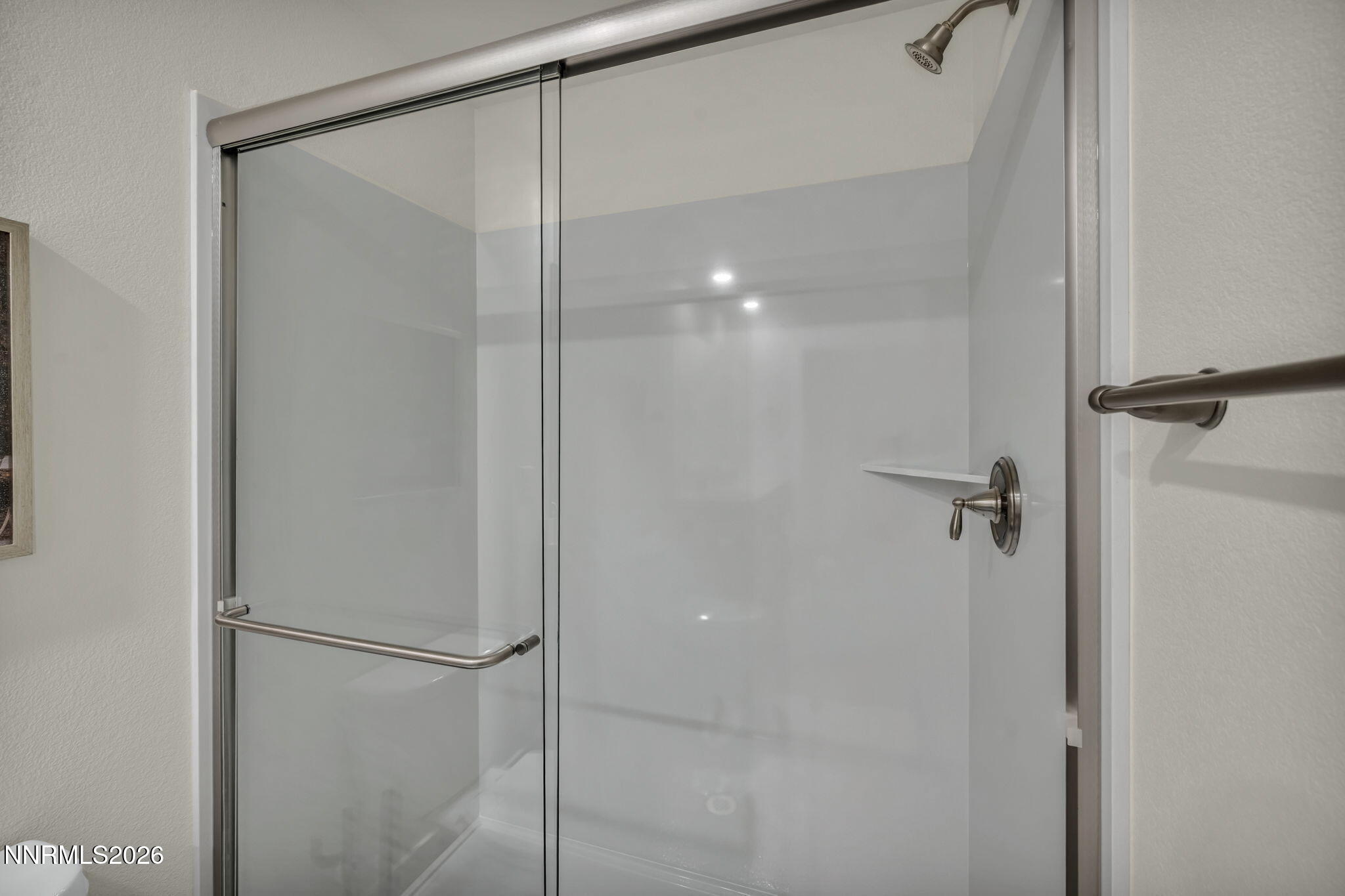 1634 Icelandic Way Reno, NV 89523 - Photo 24 of 49 a bathroom with a glass shower door