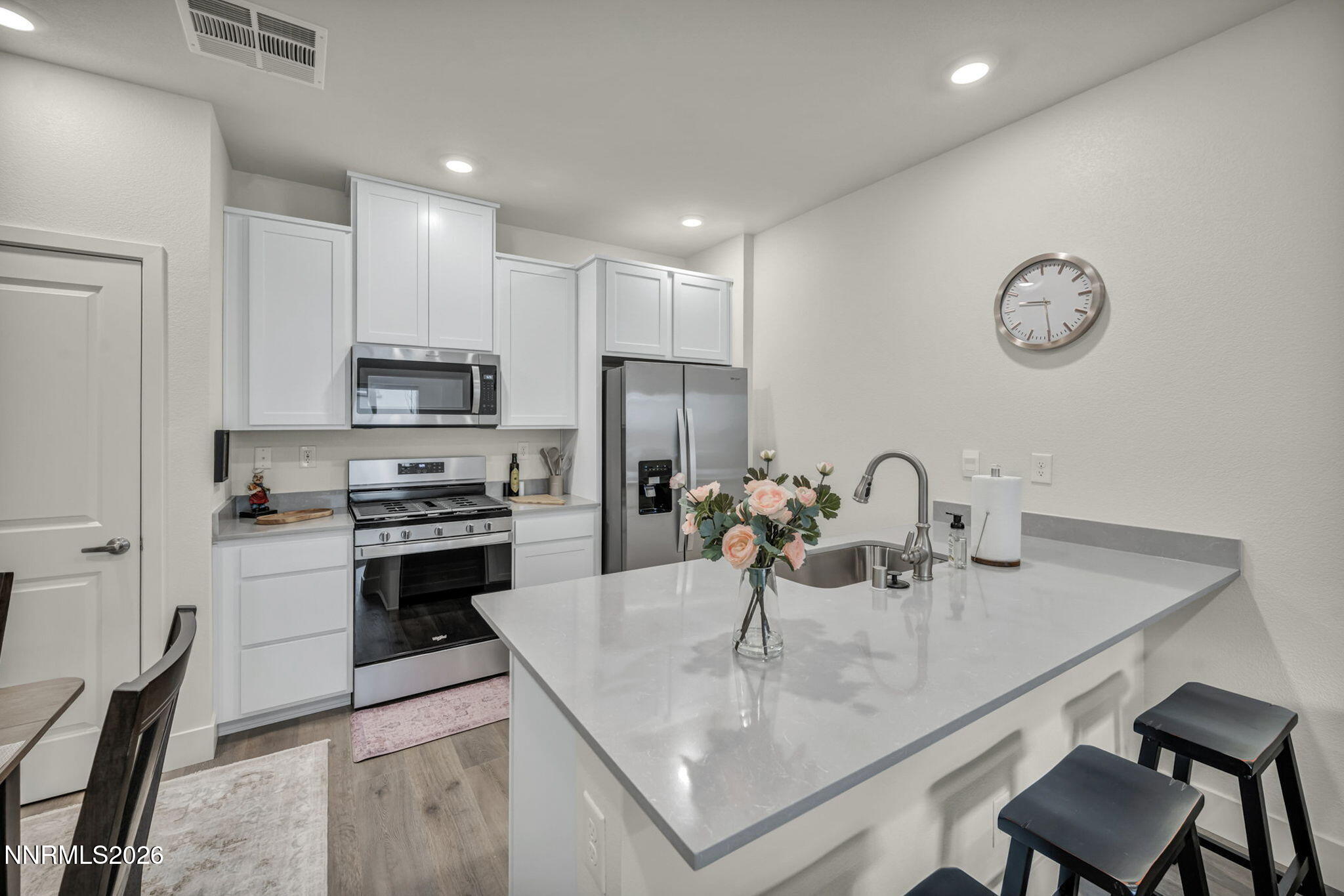 1634 Icelandic Way Reno, NV 89523 - Photo 3 of 49 a kitchen with kitchen island a sink stove and refrigerator