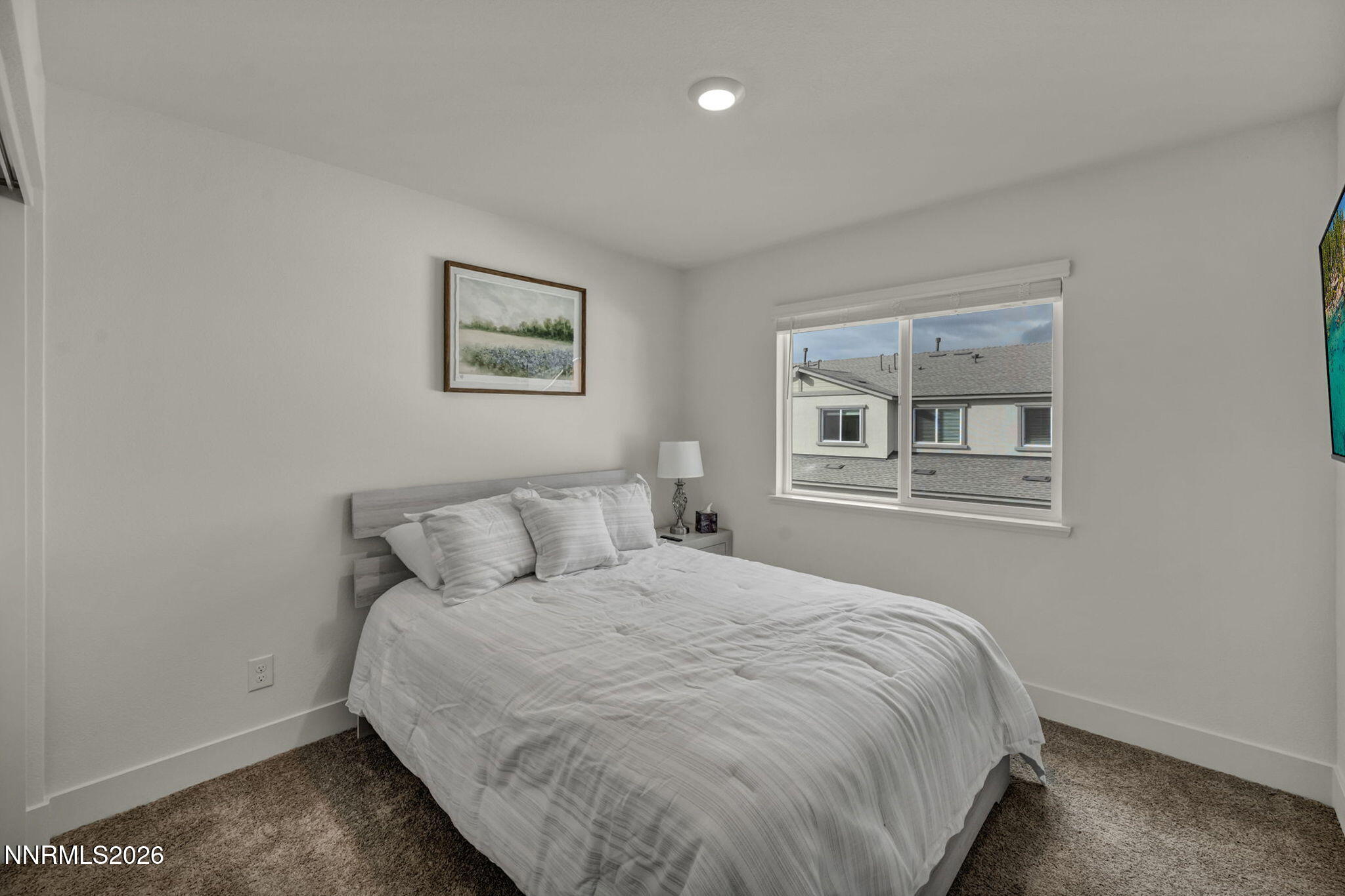 1634 Icelandic Way Reno, NV 89523 - Photo 38 of 49 a large bed sitting in a bedroom next to a window