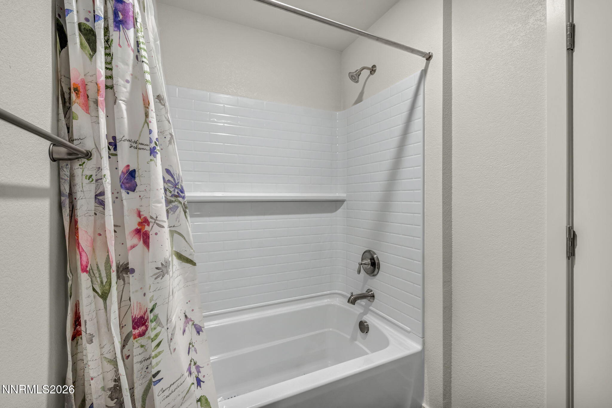 1634 Icelandic Way Reno, NV 89523 - Photo 40 of 49 a bathroom with a bathtub and a shower