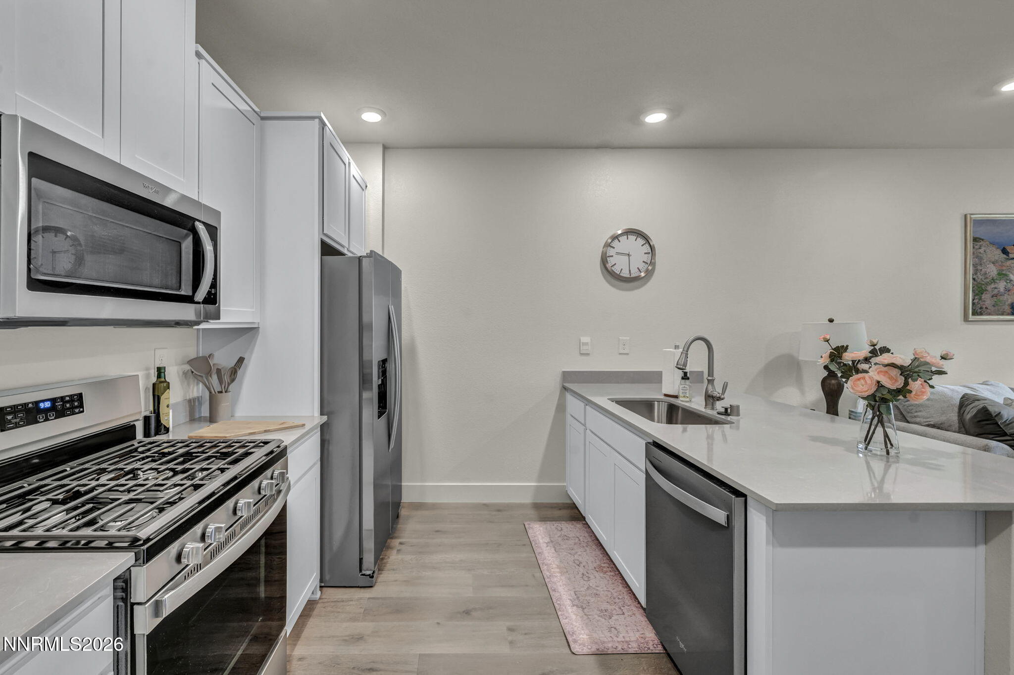 1634 Icelandic Way Reno, NV 89523 - Photo 4 of 49 a kitchen with stainless steel appliances a sink stove and refrigerator