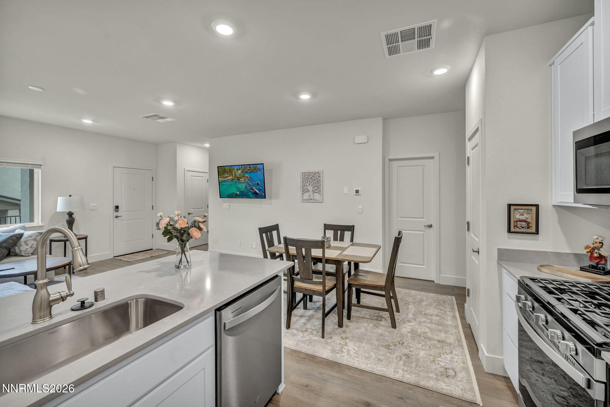 1634 Icelandic Way Reno, NV 89523 - Photo 8 of 49 a kitchen with stainless steel appliances granite countertop a sink and stove