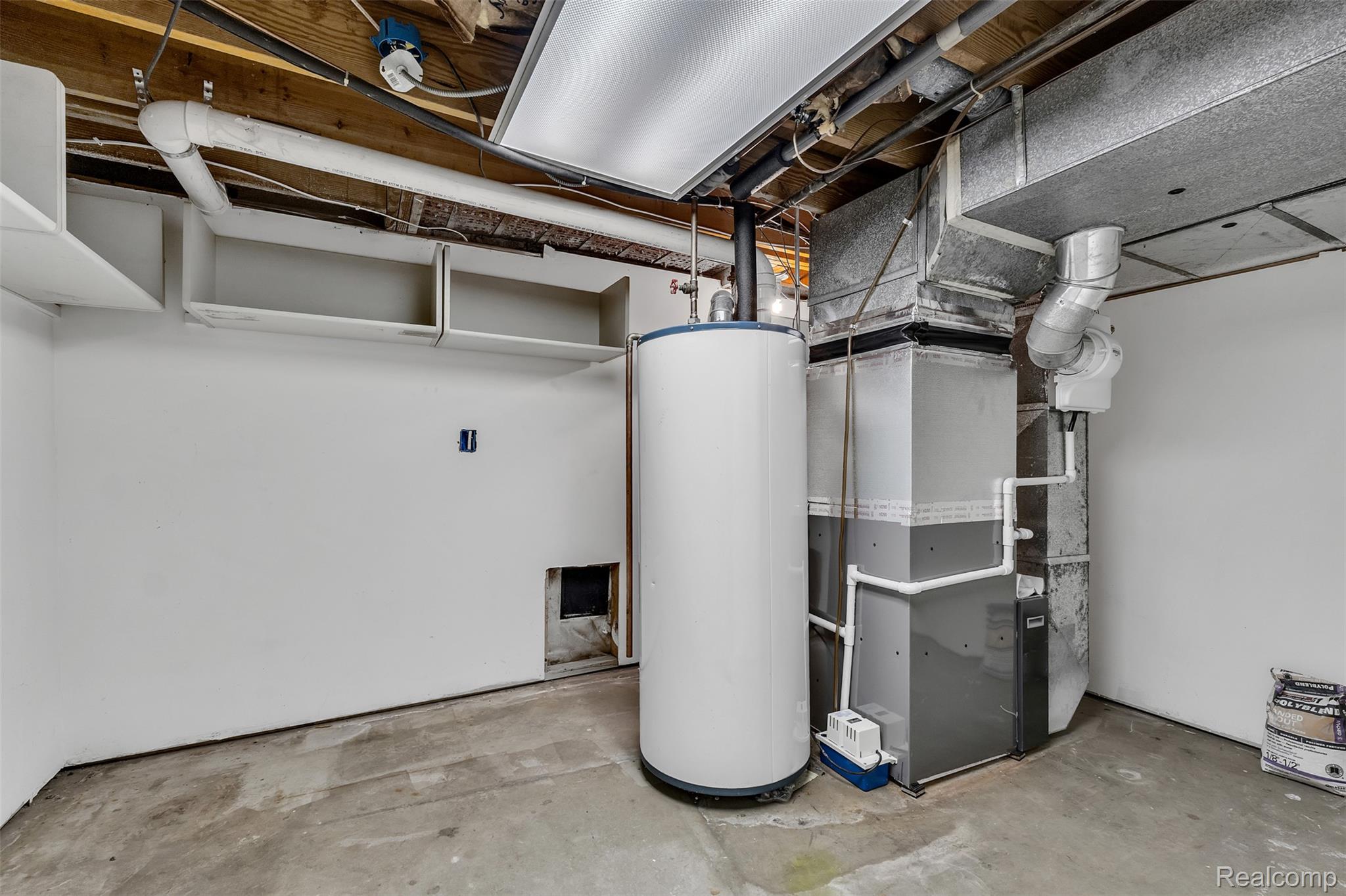 7000 Woonsocket Street Canton, MI 48187 - Photo 58 of 65 Utility area featuring a water heater, furnace system, exposed ceiling joists, and overhead ductwork