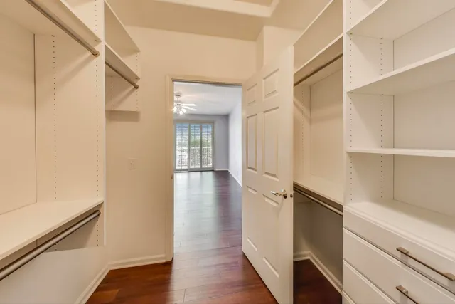 a bathroom with a sink a toilet and a large mirror