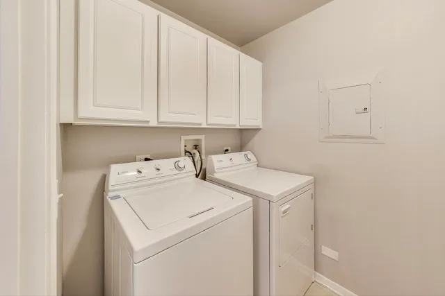 a view of a balcony with a barbeque