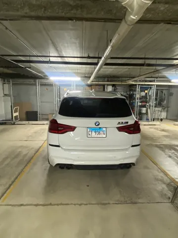 a city street lined with buildings and trees
