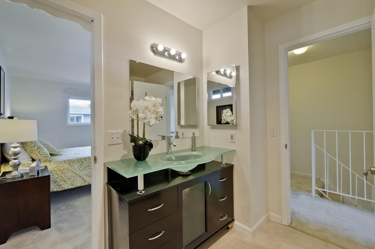 1133 Reed Avenue, Unit B Sunnyvale, CA 94086 - Photo 15 of 33 a bathroom with a sink and a mirror