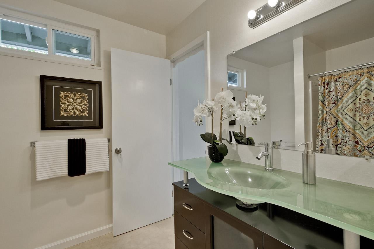 1133 Reed Avenue, Unit B Sunnyvale, CA 94086 - Photo 16 of 33 a room with a sink and a mirror