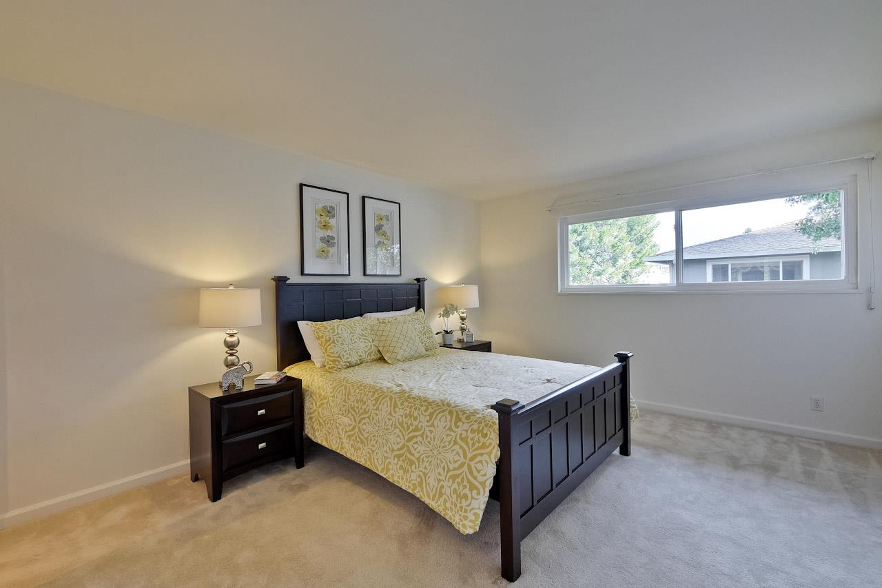 1133 Reed Avenue, Unit B Sunnyvale, CA 94086 - Photo 17 of 33 a bedroom with a bed and window