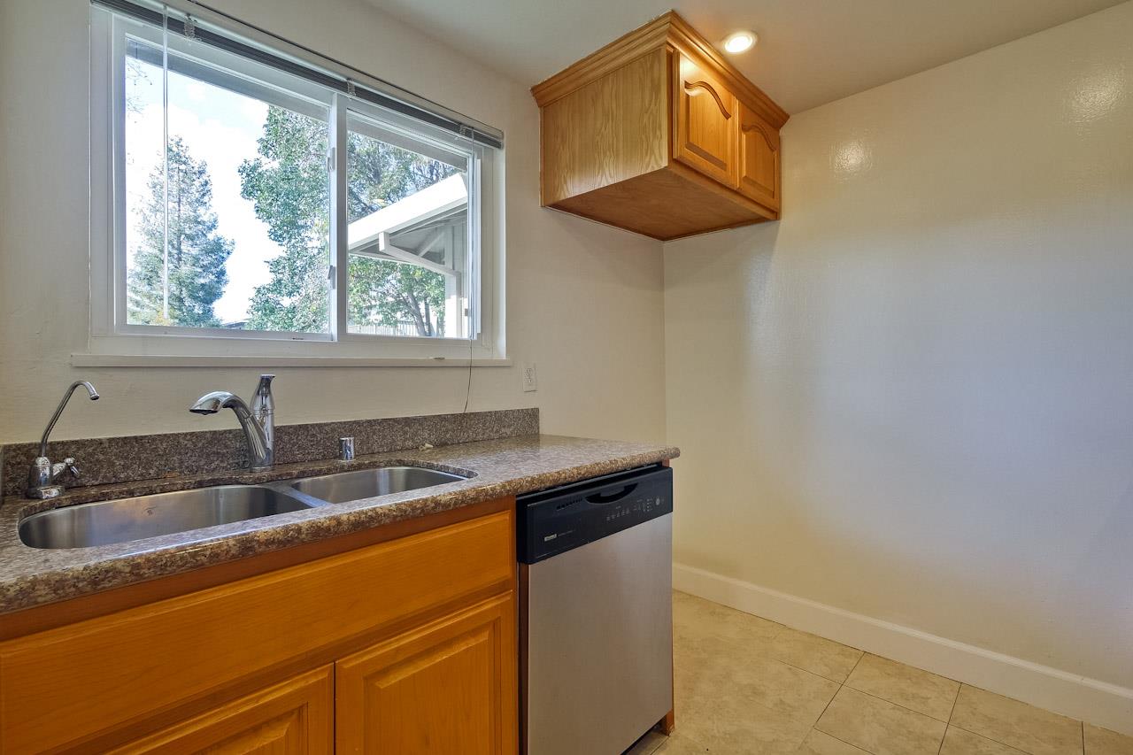 1133 Reed Avenue, Unit B Sunnyvale, CA 94086 - Photo 6 of 33 a kitchen with granite countertop a sink and a window