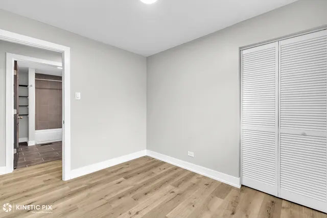 an empty room with wooden floor