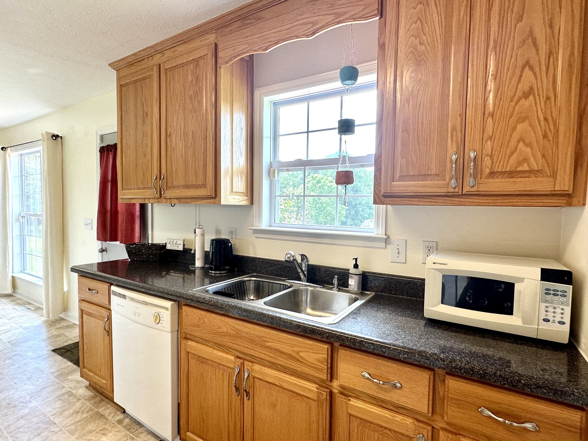 26 Ridgeline Drive Fayetteville, TN 37334 - Photo 11 of 39 a kitchen with granite countertop a sink a stove and cabinets