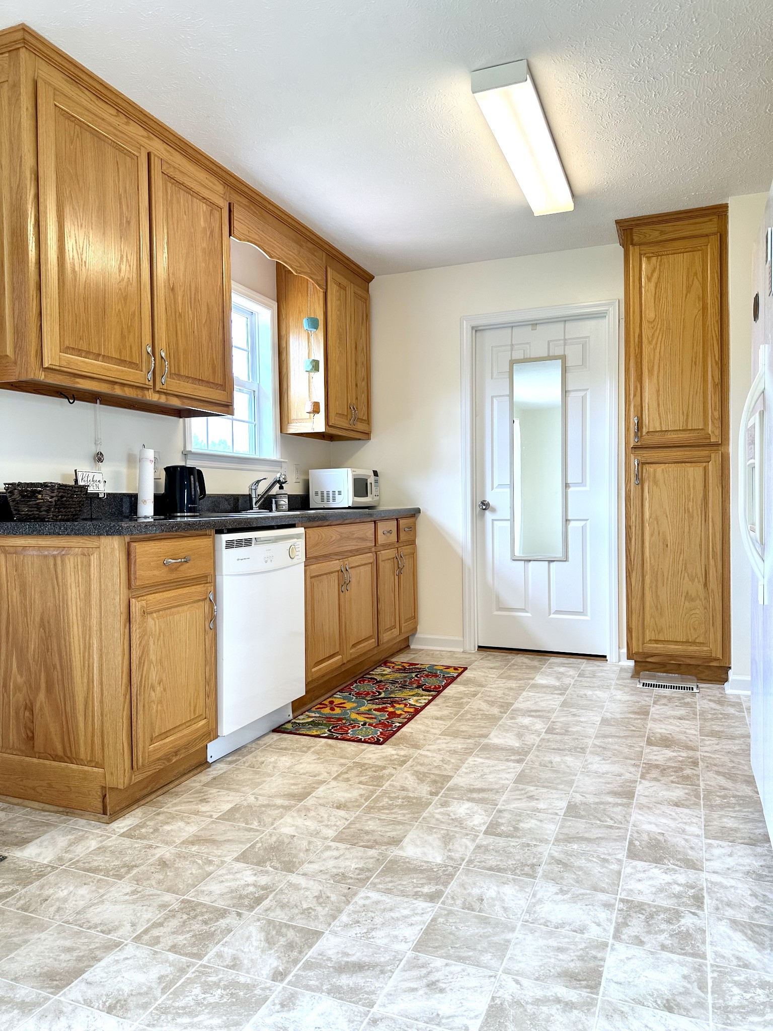 26 Ridgeline Drive Fayetteville, TN 37334 - Photo 12 of 39 a view of a kitchen with sink cabinets and outdoor space
