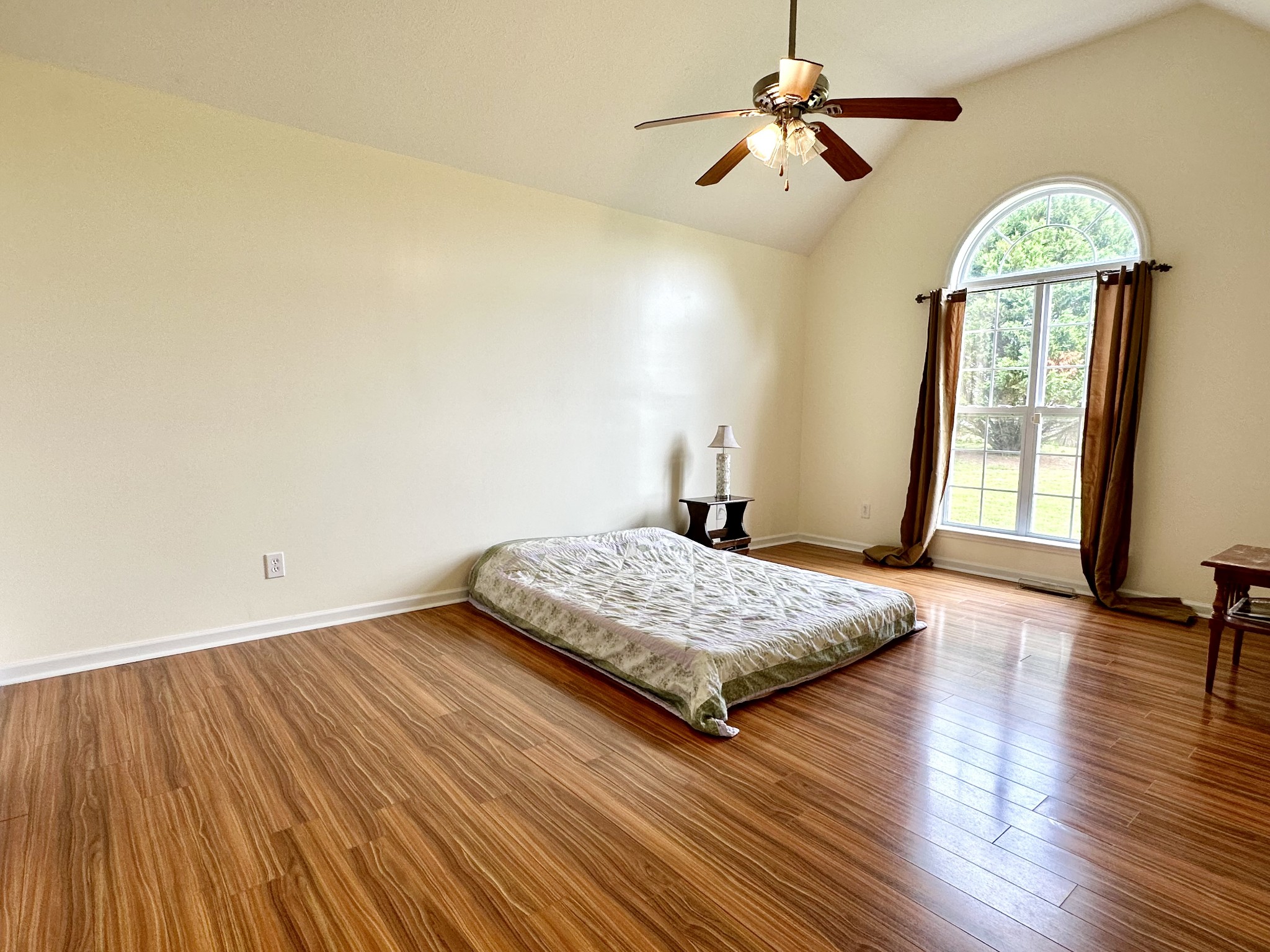 26 Ridgeline Drive Fayetteville, TN 37334 - Photo 16 of 39 a bedroom with a bed and a chandelier