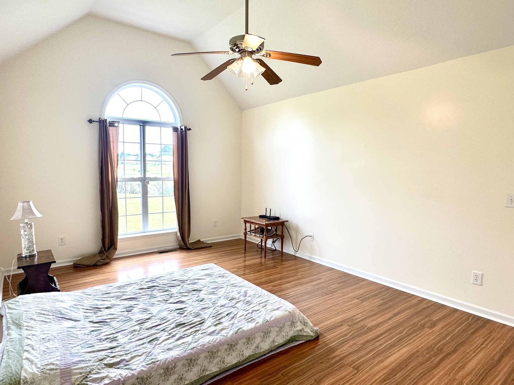 26 Ridgeline Drive Fayetteville, TN 37334 - Photo 17 of 39 a bedroom with a bed and a chandelier