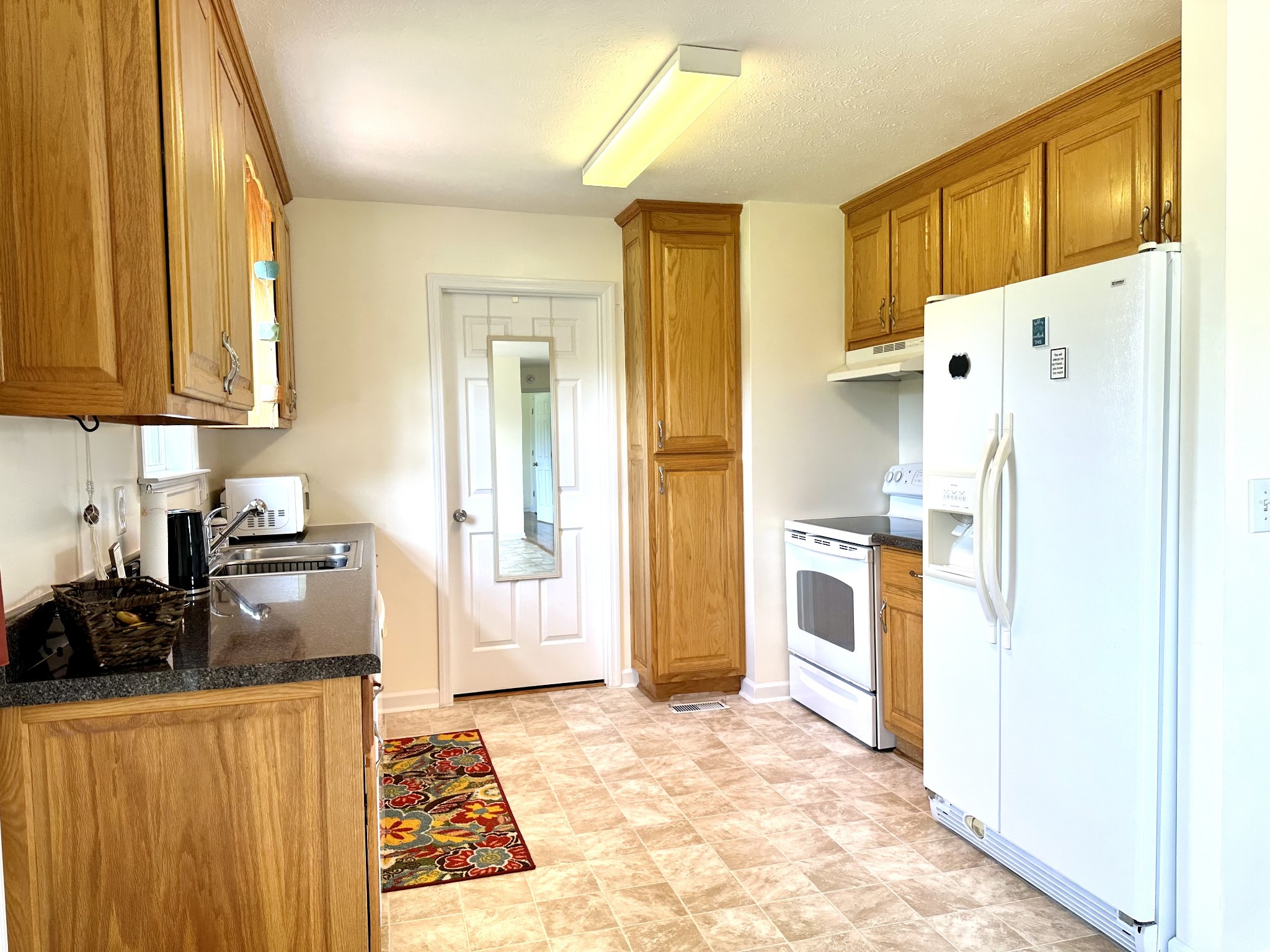 26 Ridgeline Drive Fayetteville, TN 37334 - Photo 9 of 39 a kitchen with a refrigerator and a stove top oven