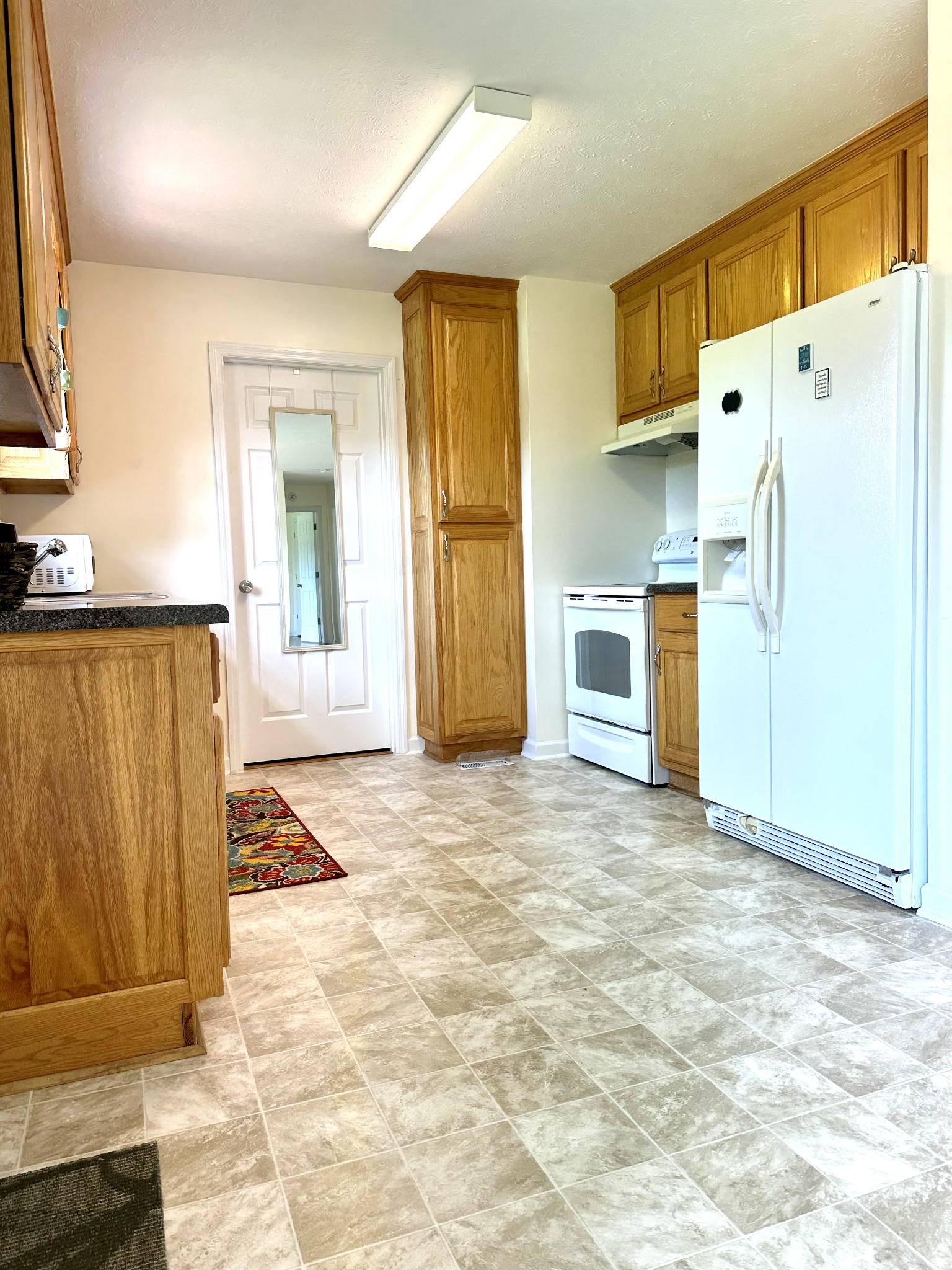 26 Ridgeline Drive Fayetteville, TN 37334 - Photo 10 of 39 a view of a kitchen with a sink and a refrigerator