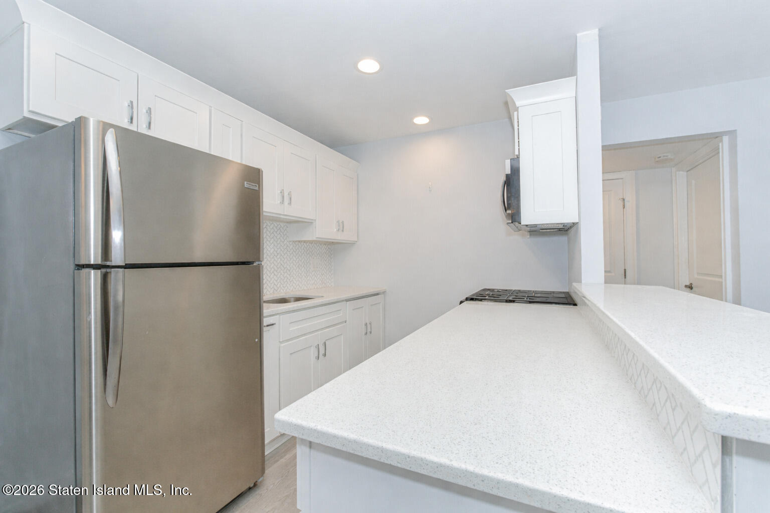 4199A Amboy Road, Unit 5A Staten Island, NY 10308 - Photo 11 of 19 a kitchen with a refrigerator and a sink