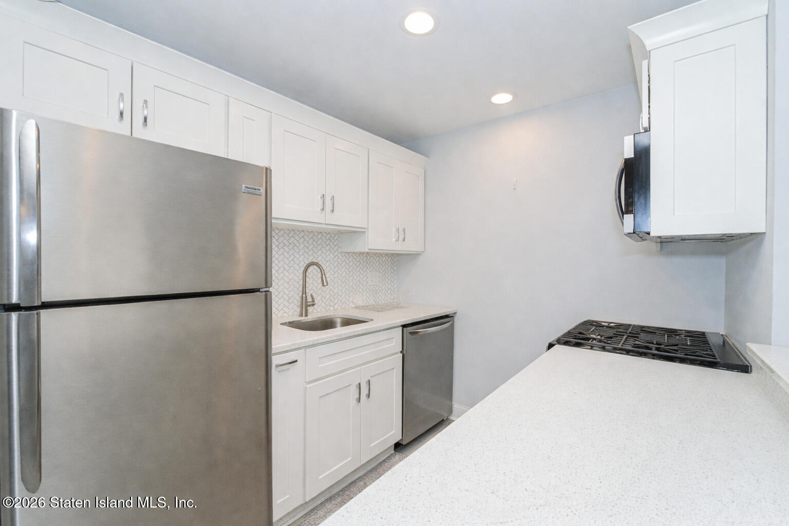 4199A Amboy Road, Unit 5A Staten Island, NY 10308 - Photo 12 of 19 a white refrigerator freezer sitting inside of a kitchen