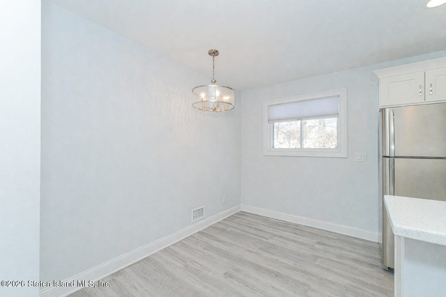 4199A Amboy Road, Unit 5A Staten Island, NY 10308 - Photo 13 of 19 a view of a room with wooden floor and windows