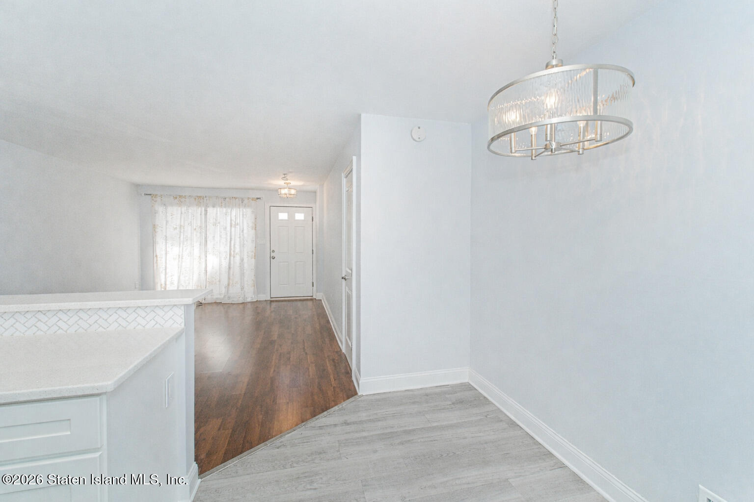 4199A Amboy Road, Unit 5A Staten Island, NY 10308 - Photo 14 of 19 an empty room with wooden floor and windows