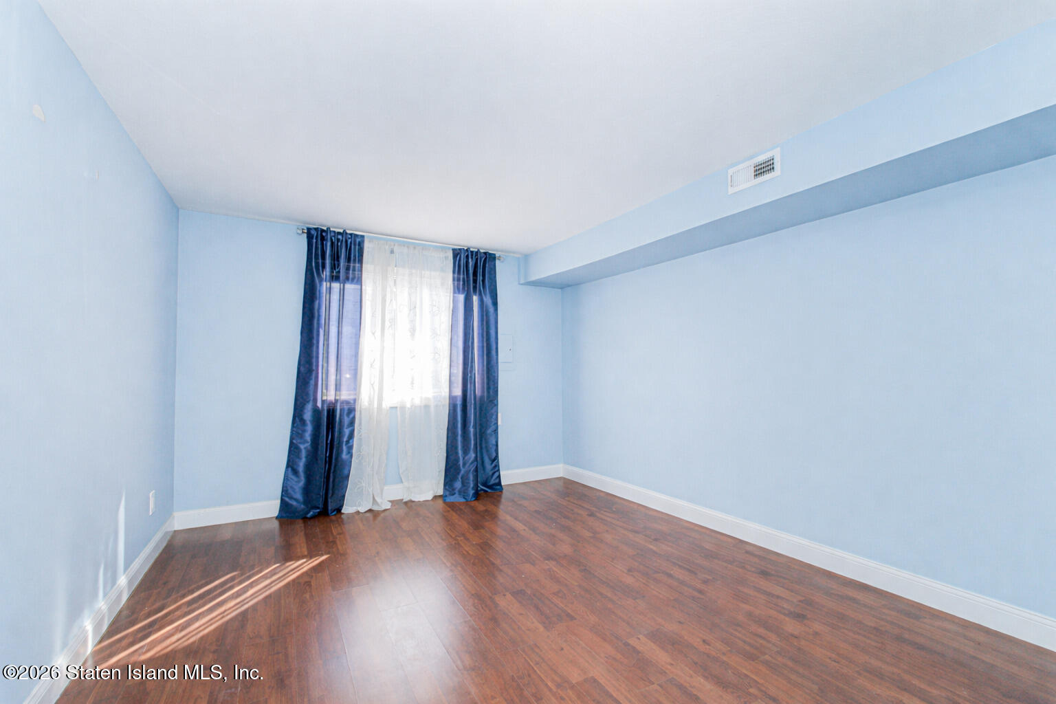 4199A Amboy Road, Unit 5A Staten Island, NY 10308 - Photo 17 of 19 a view of empty room with wooden floor