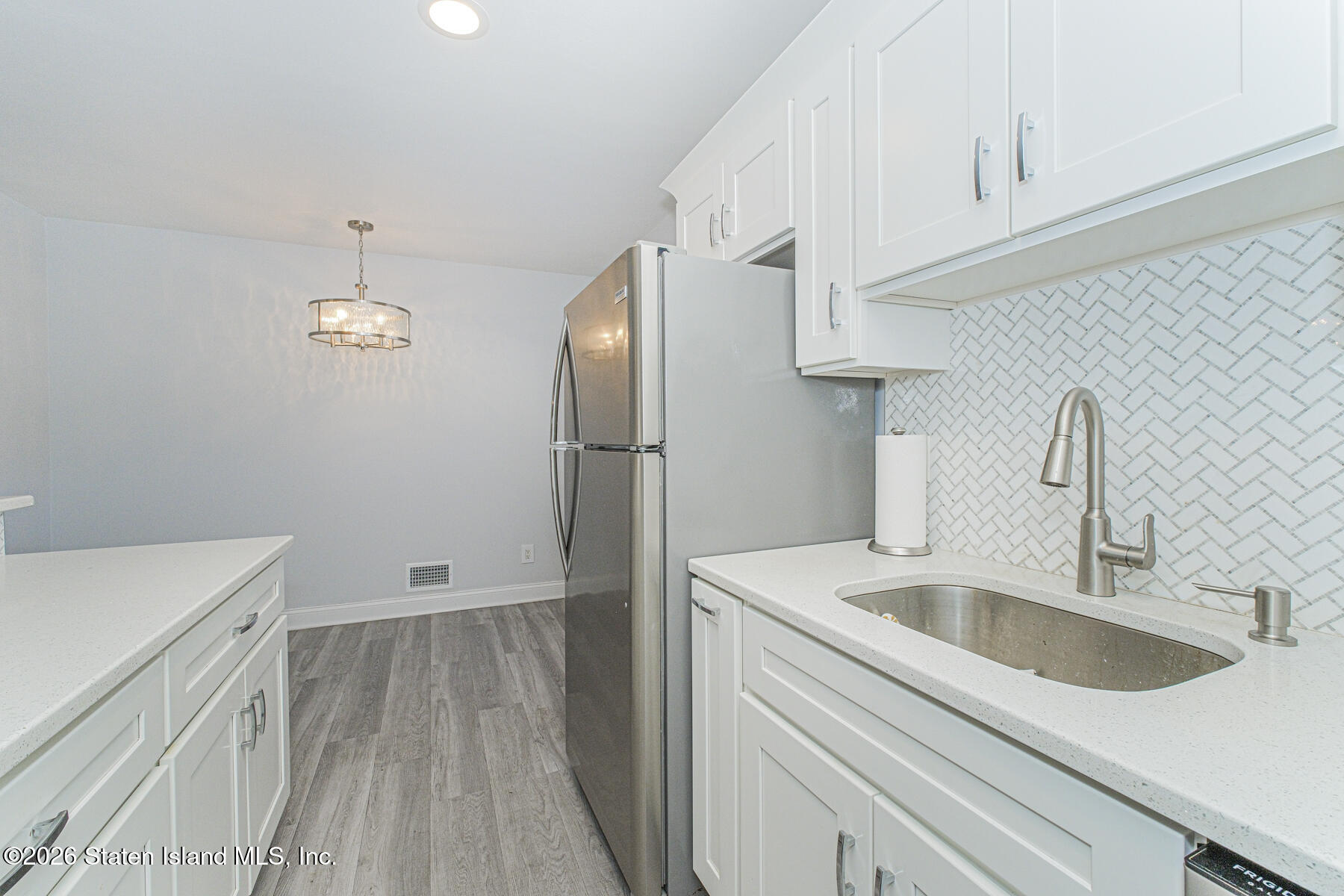 4199A Amboy Road, Unit 5A Staten Island, NY 10308 - Photo 19 of 19 a kitchen with a sink and a refrigerator