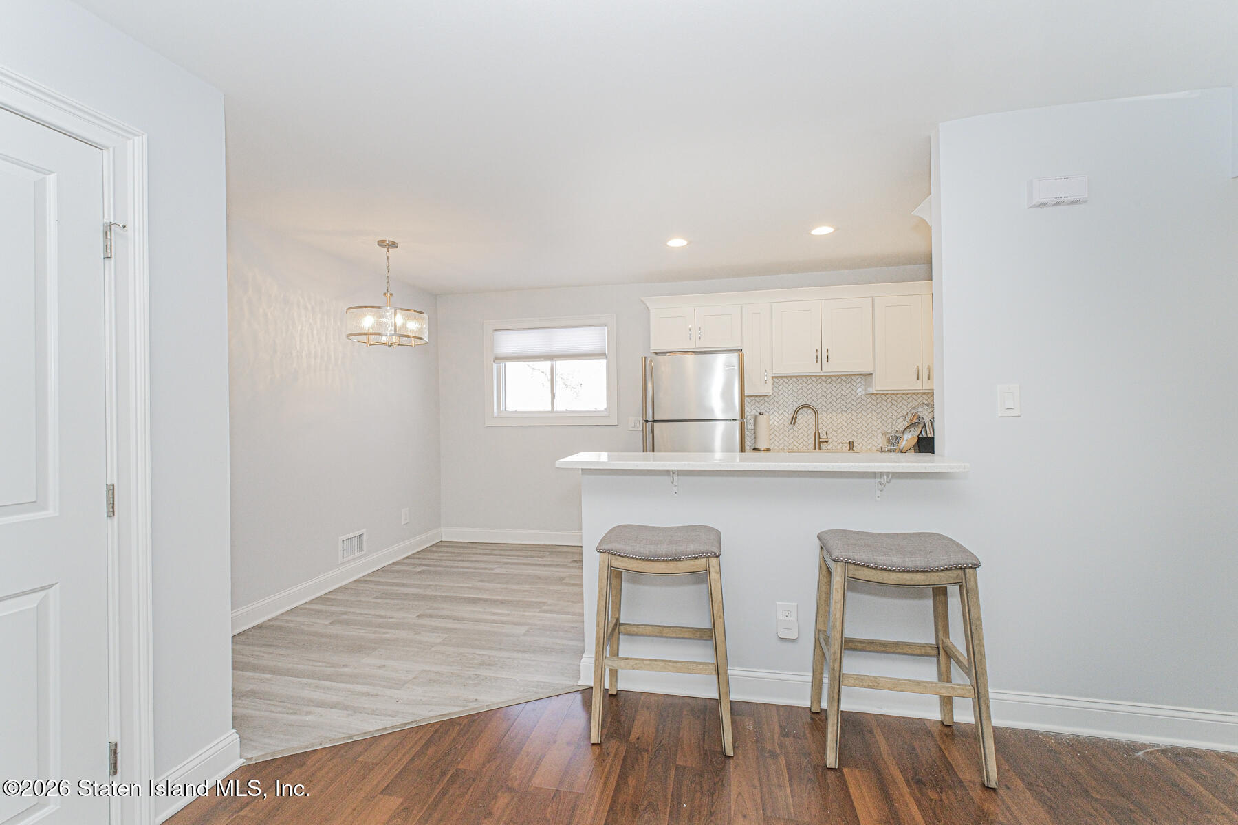 4199A Amboy Road, Unit 5A Staten Island, NY 10308 - Photo 5 of 19 a dining room with wooden floor and window