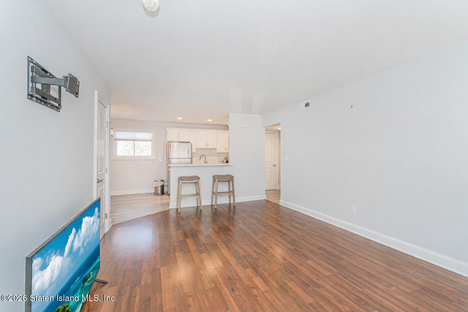 4199A Amboy Road, Unit 5A Staten Island, NY 10308 - Photo 6 of 19 a view of a livingroom with wooden floor and a cabinet