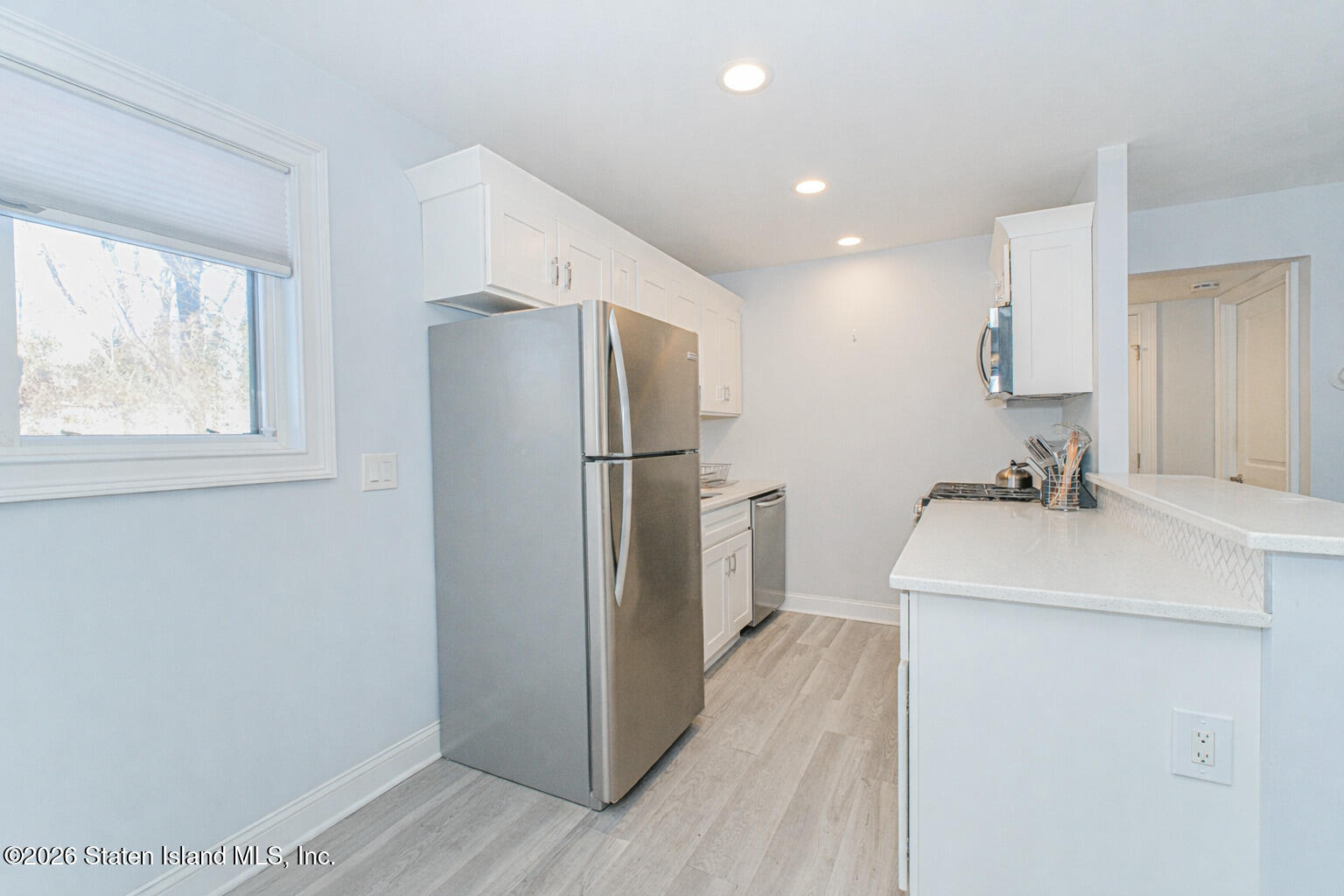 4199A Amboy Road, Unit 5A Staten Island, NY 10308 - Photo 8 of 19 a kitchen with a refrigerator and a sink