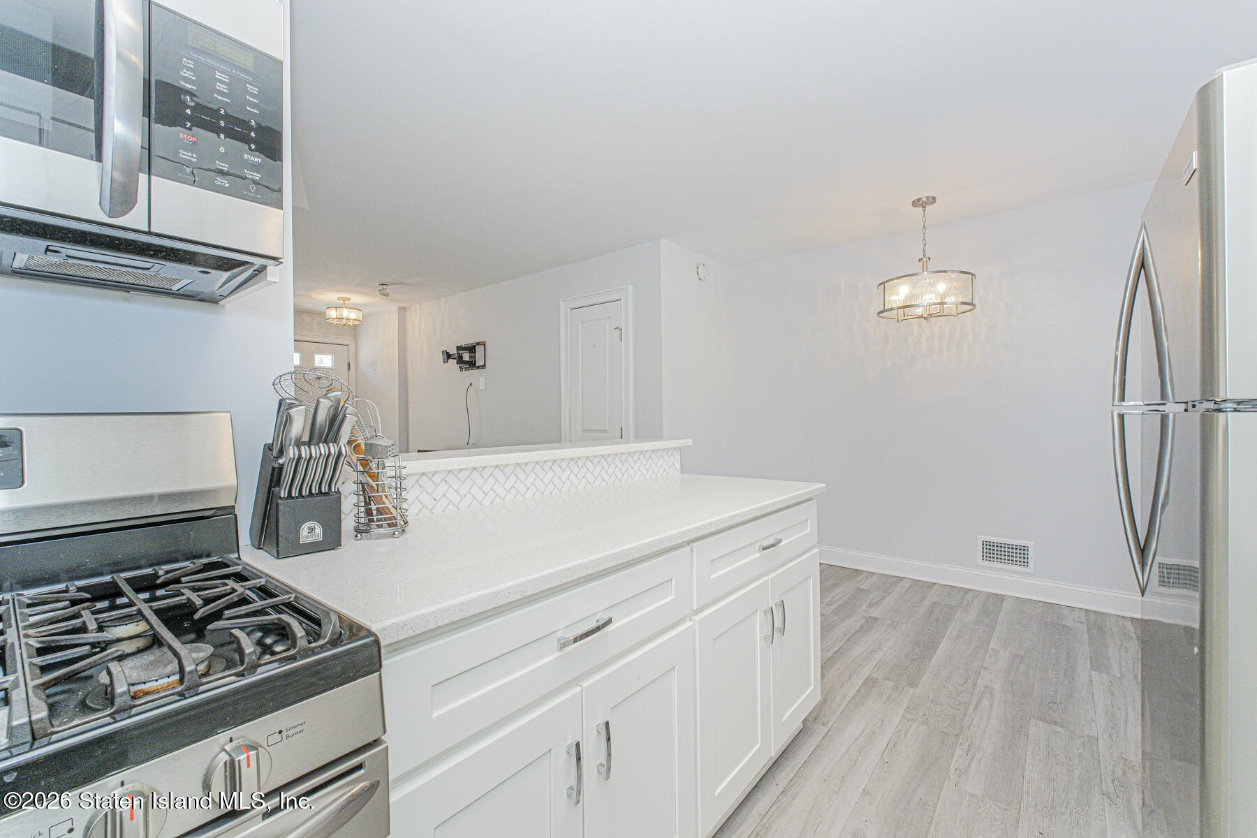 4199A Amboy Road, Unit 5A Staten Island, NY 10308 - Photo 9 of 19 a kitchen with sink stove and refrigerator