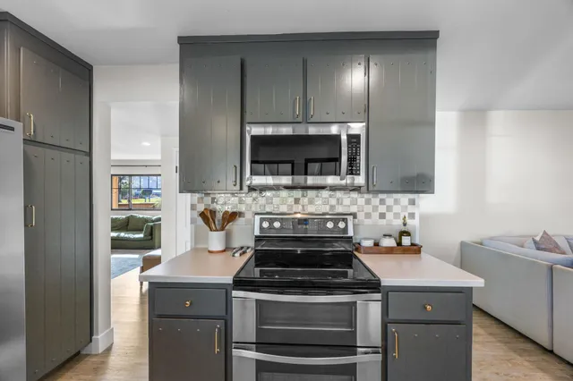 a kitchen with a stove and a microwave