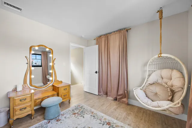 a living room with a couch and a chandelier