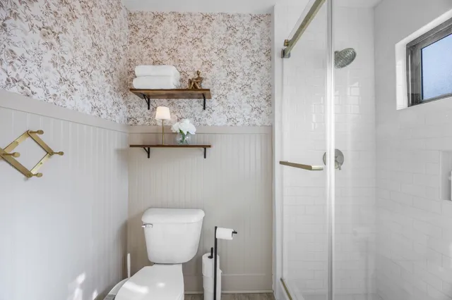 a bathroom with a toilet and a sink