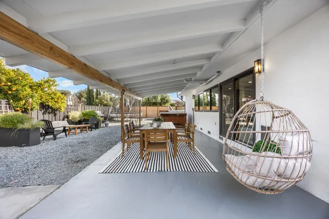 a living room with furniture and a table