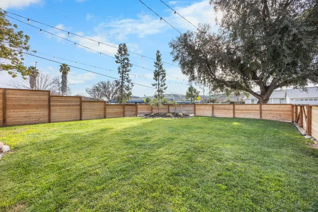 a view of outdoor space with deck and yard