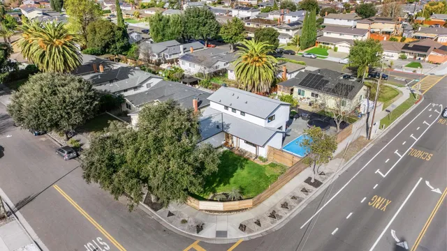 a view of a swimming pool with a patio