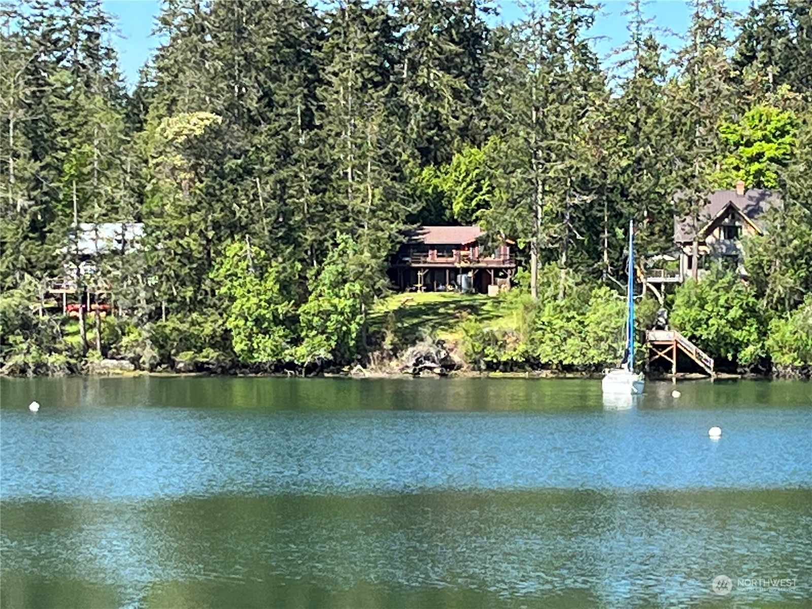 1481 Griffith Point Road Nordland, WA 98358 - Photo 1 of 39 a view of a lake with a house