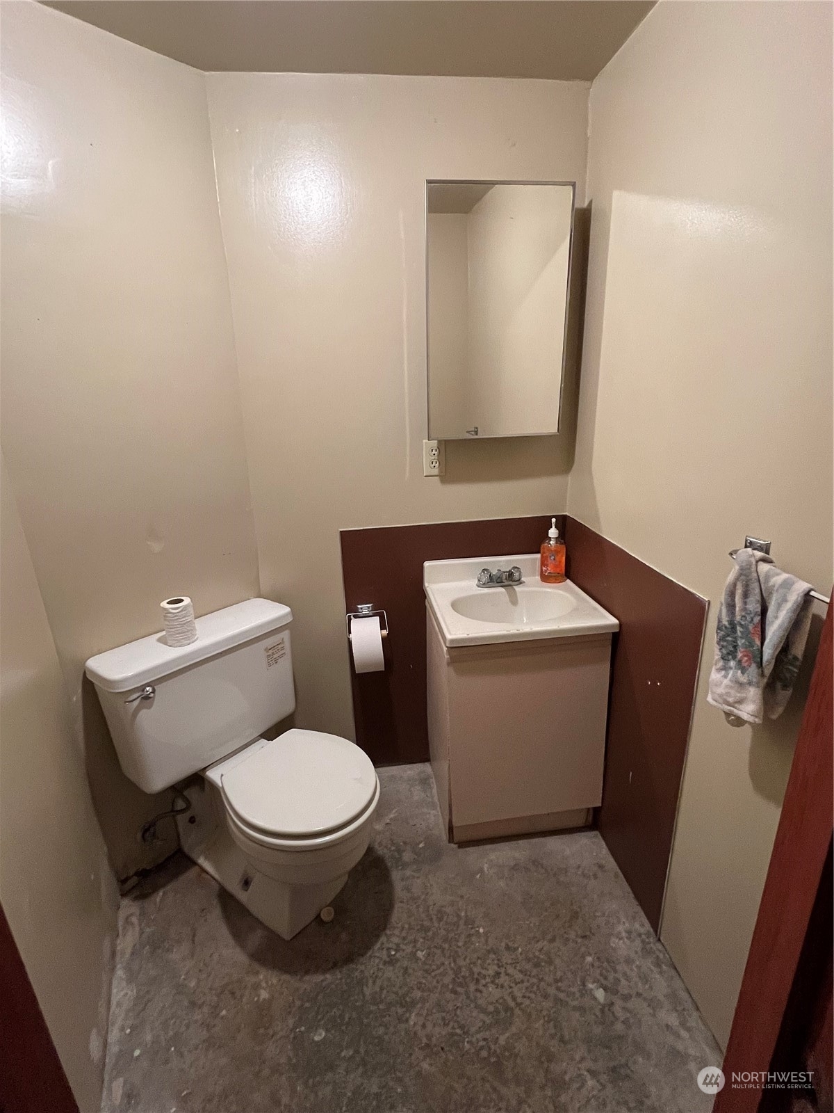 1481 Griffith Point Road Nordland, WA 98358 - Photo 16 of 39 a white toilet sitting next to a bathroom sink