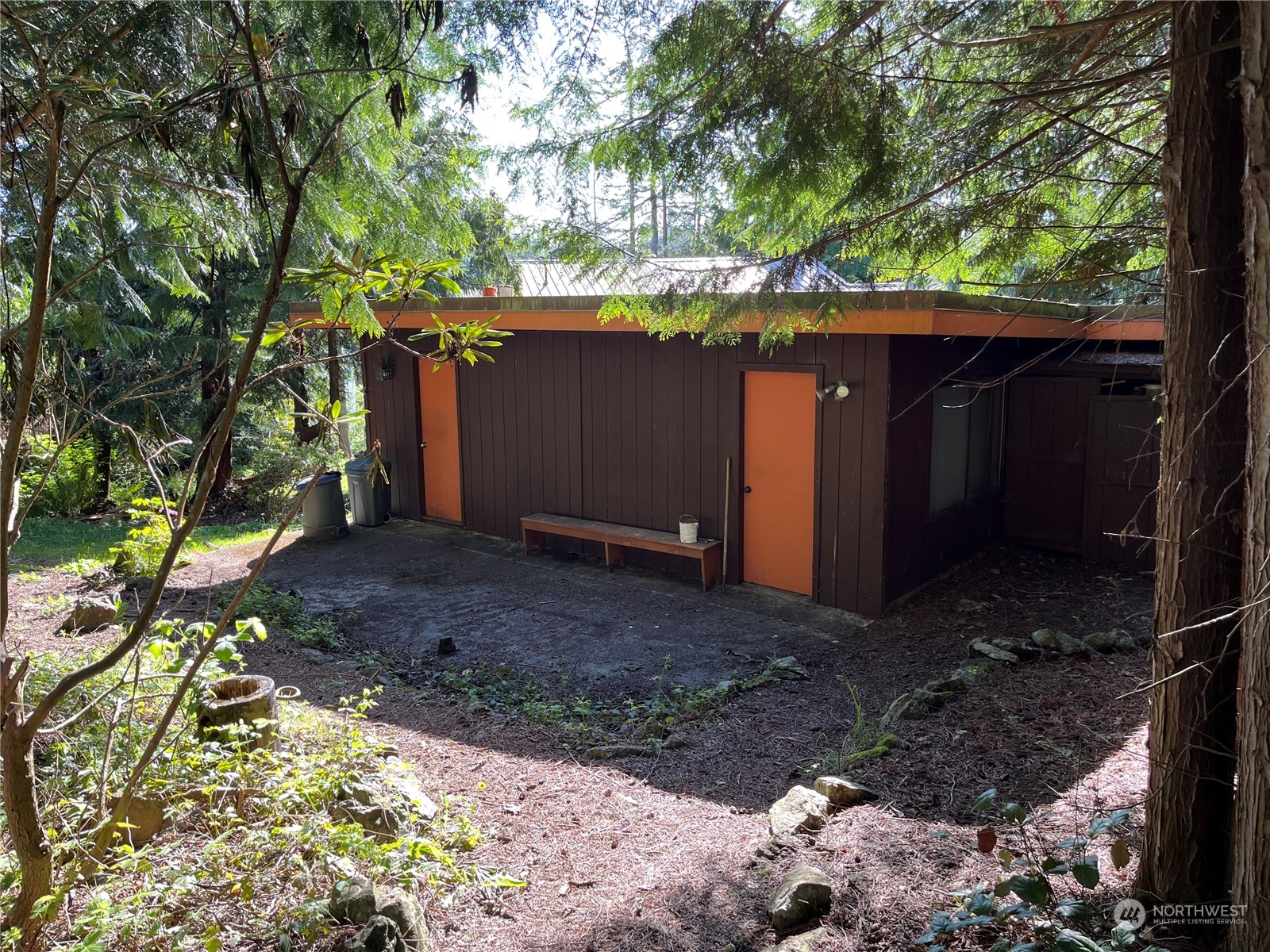 1481 Griffith Point Road Nordland, WA 98358 - Photo 20 of 39 a view of a yard with large tree and wooden fence