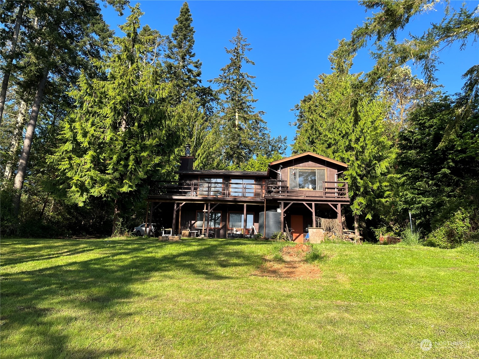 1481 Griffith Point Road Nordland, WA 98358 - Photo 34 of 39 a view of a house with a swimming pool