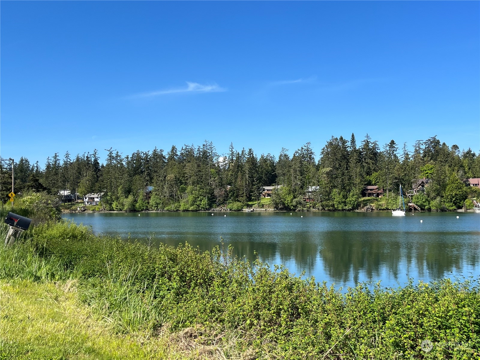 1481 Griffith Point Road Nordland, WA 98358 - Photo 38 of 39 a view of a lake with houses in the back