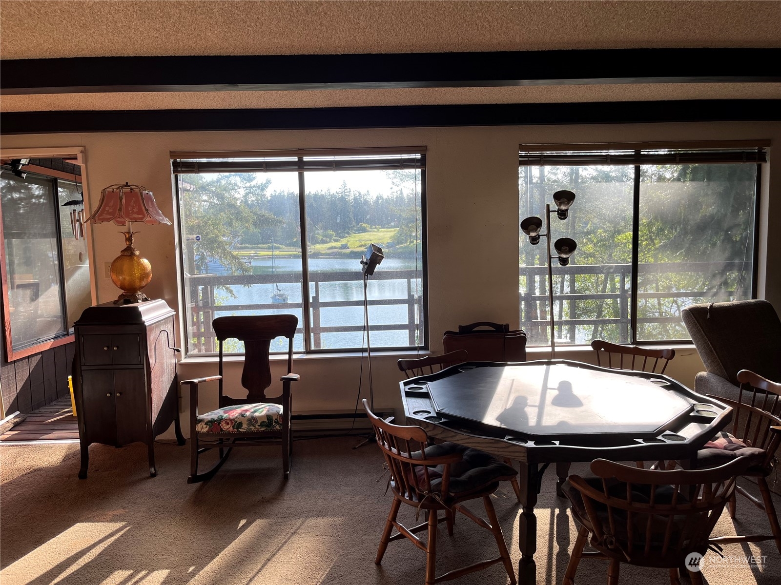 1481 Griffith Point Road Nordland, WA 98358 - Photo 6 of 39 a living room with furniture and a floor to ceiling window