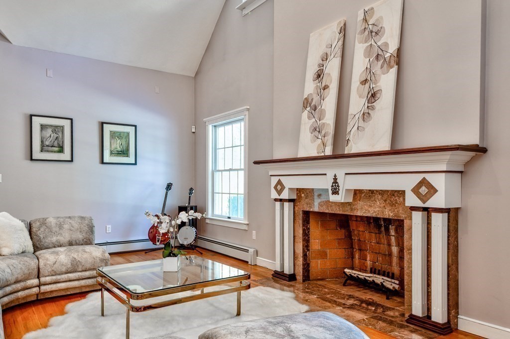 6 Barnbridge Circle Framingham, MA 01701 - Photo 11 of 41 a living room with furniture a rug and a window