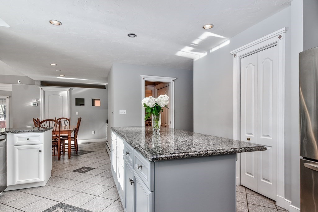 6 Barnbridge Circle Framingham, MA 01701 - Photo 13 of 41 a dining hall with stainless steel appliances granite countertop a sink and dishwasher