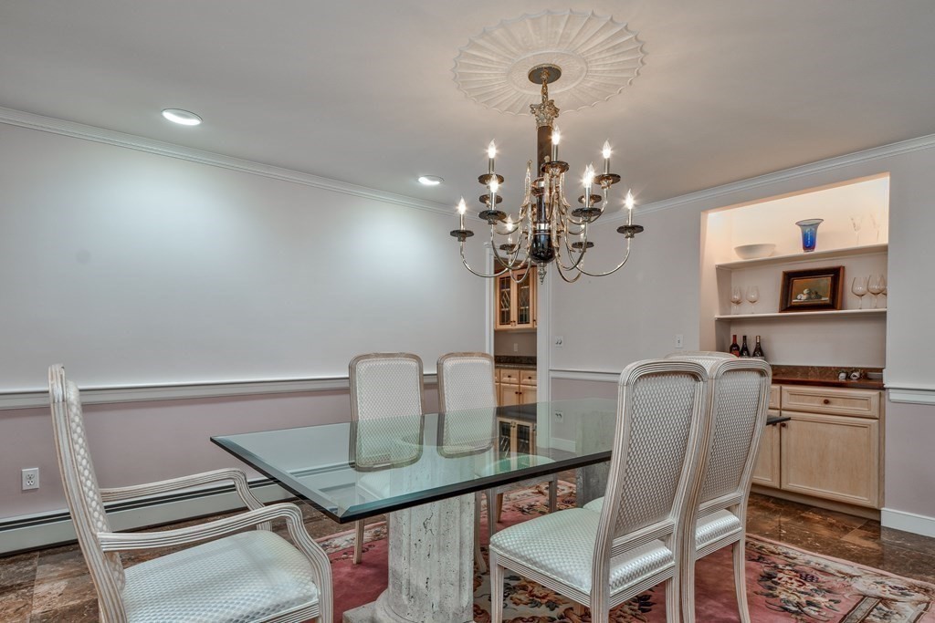 6 Barnbridge Circle Framingham, MA 01701 - Photo 21 of 41 a dining room with furniture and chandelier