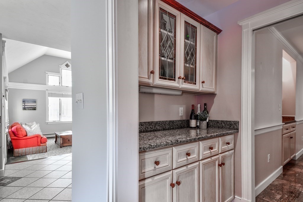 6 Barnbridge Circle Framingham, MA 01701 - Photo 23 of 41 a kitchen with granite countertop a sink stove and cabinets