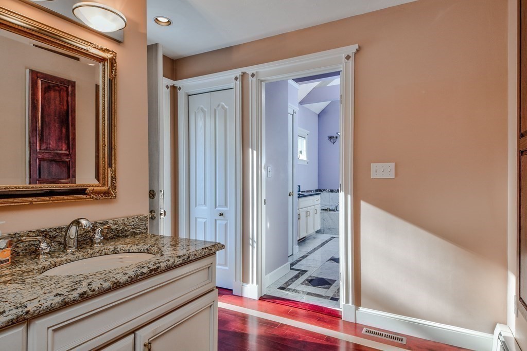 6 Barnbridge Circle Framingham, MA 01701 - Photo 27 of 41 a bathroom with a granite countertop sink and a mirror